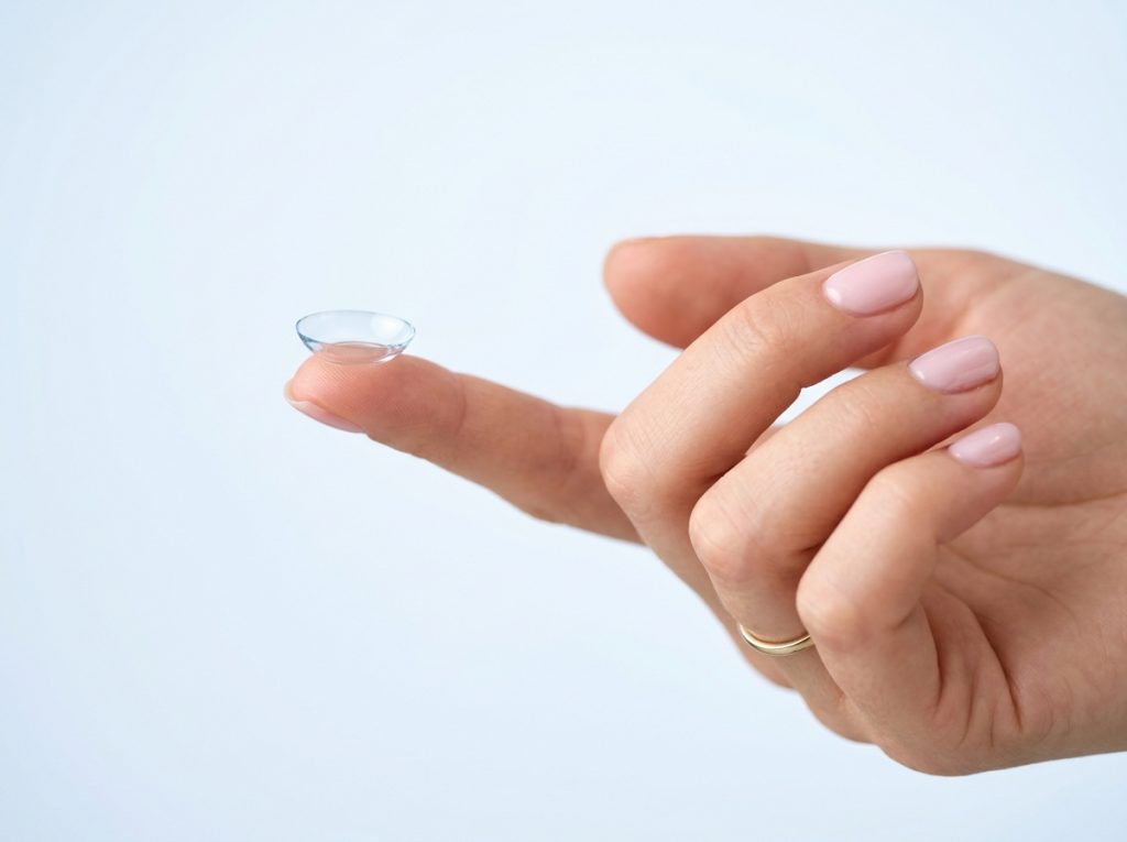 Contact lens on fingertip